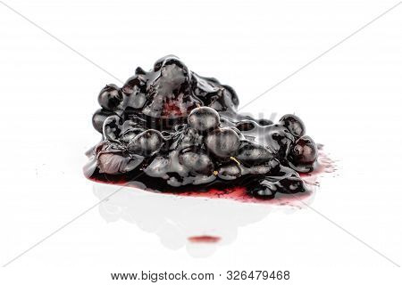 One Whole Crushed Fresh Black Blackberry Isolated On White Background