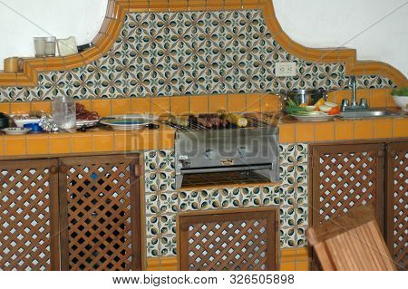 Fancy Barbecue Grill With Ceramic Tiles And Wooden Inserts