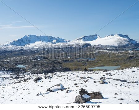 Panoramic View From Krossbu On Glacier Smorstabbreen, Snow-capped Mountains And Blue Lakes In Jotunh