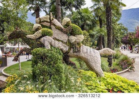 Merano, Italy - August 5, 2019: Jockey Formed By Flowers At The Spa Promenade In Merano, Italy,