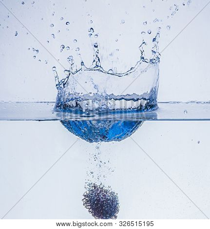 Ripe Rambutan Fruit In In Water Isolated On A White Background
