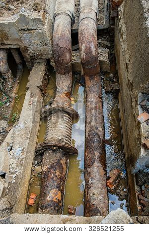 Old Leaky Pipes In The Pit. Preparation For Pipe Replacement.