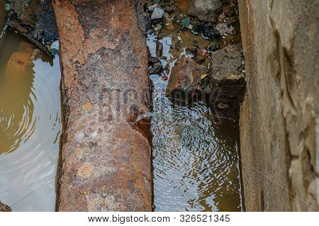 Old Leaky Pipes In The Pit. Preparation For Pipe Replacement.