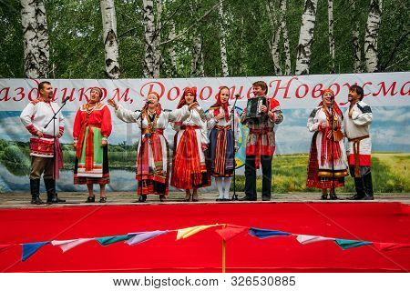 Voronezh, Russia - Circa, 2012: Traditional Russian Folklore Ensemble At The Fair, Accordionist And 
