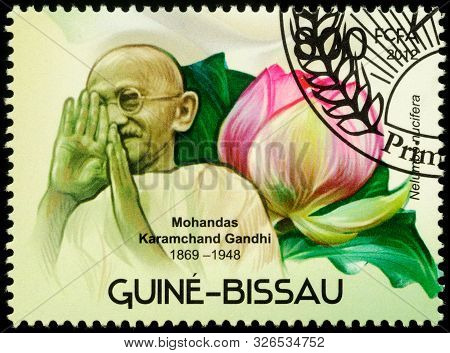 Moscow, Russia - October 08, 2019: Stamp Printed In Guinea-bissau Shows Mahatma Gandhi (mohandas Kar