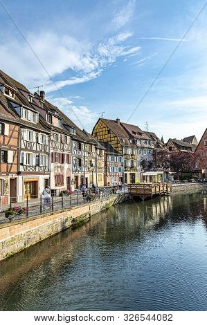 Colmar, France - June 4, 2019: Colorful Traditional French Houses On The Side Of River Lauch In Peti