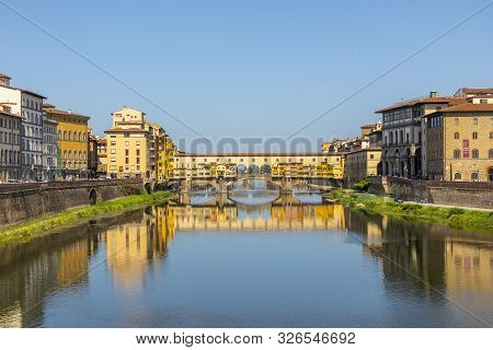 Firenze, Italy - August 13, 2019: Famous Historic Ponte Veccio In Florence At River Arno