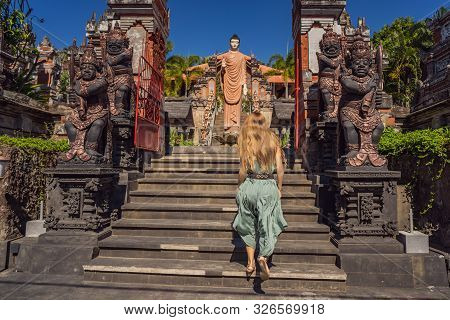 Young Woman Tourist In Budhist Temple Brahma Vihara Arama Banjar Bali, Indonesia