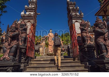 Young Man Tourist In Budhist Temple Brahma Vihara Arama Banjar Bali, Indonesia