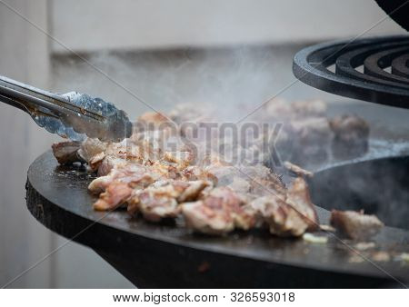 Cook Roasts Chicken Meat In Moscow At The Fair On Red Square