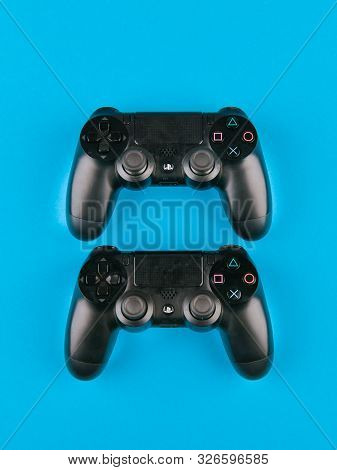 Game Joystick. Playstation. On A Blue Background Top View. The New Sony Dualshock 4 With Playstation