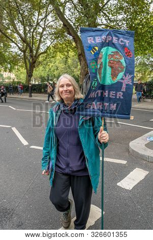 London, Uk - October 7, 2019: Participants Of The Protest Rally Extinction Rebellion - Woman With A 