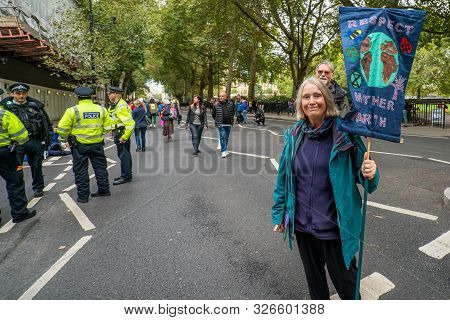 London, Uk - October 7, 2019: Participants Of The Protest Rally Extinction Rebellion - Woman With A 