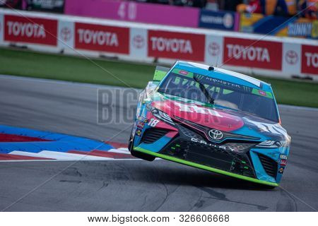 September 29, 2019 - Concord, North Carolina, USA: Kyle Busch (18) battles for position for the Bank of America ROVAL 400 at Charlotte Motor Speedway in Concord, North Carolina.