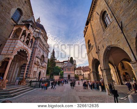 Bergamo, Lombardy, Italy - October 5 2019 View Of The Battistero, Campanone Tower And A Side Of The 
