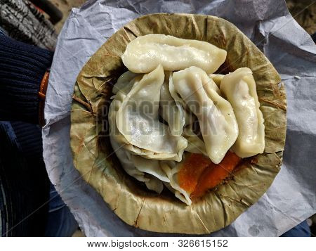 Indian-style Momos From Darjeeling, India With Garlic Chutney. Momo Is A Type Of South Asian Dumplin
