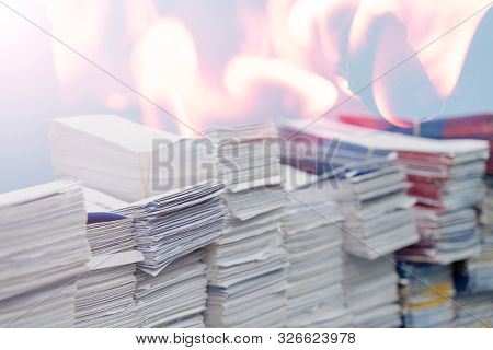 Double Exposure, Stacks Of Paper Files Or Documents And Fire.