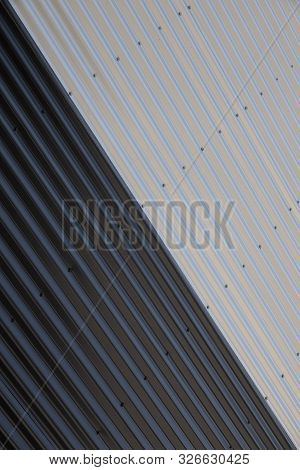 Close-up Of Junction Of Black And White Corrugated Surfaces With Diagonal Division. Industrial Yin Y