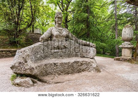 Stone Sculpture At Famous Monsters Park, Also Named Sacred Grove Or Gardens Of Bomarzo In Bomarzo, V