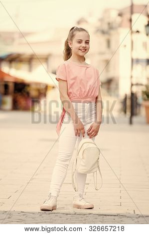 Kid Long Hair Enjoy Walk Sunny Day. Summer Holidays. Charming Stylish Fashionable Girl. Little Child