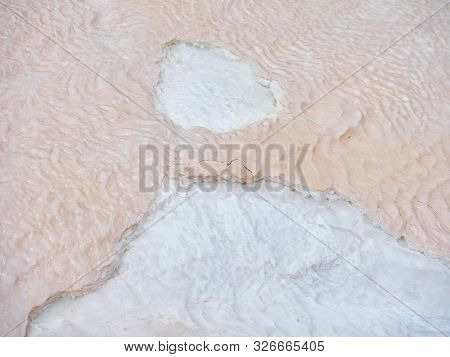 The Destruction Of The Wave-like Texture Of White Calcite Stalactites Covering A Cascade Of Terraced
