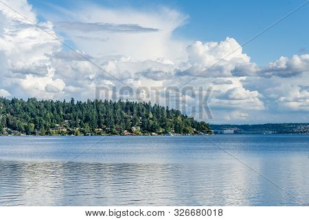 Billowing Clouds Hover Over Mercer Island In Washington State.