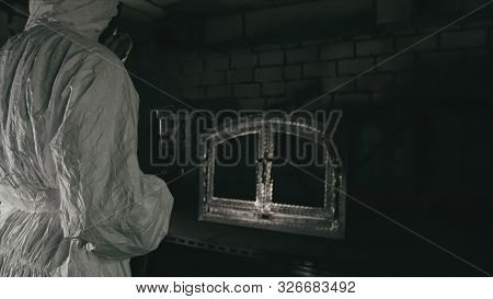 Forge Workshop. Smithy Manual Production. A Worker Paints A Part From A Spray Gun In Black Color. Ai