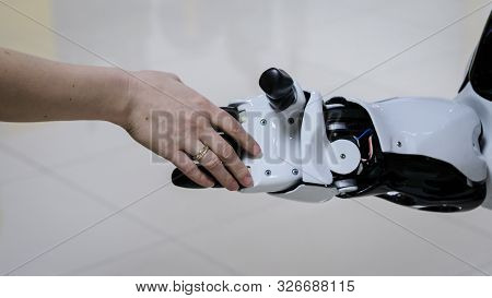 Man Welcomes The Robot By Shaking Hands