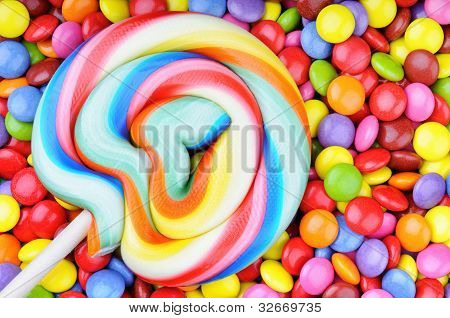 Striped Lollipop And Multicolored Smarties