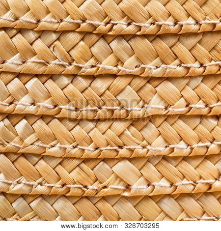 Textile Square Background - Texture Of Stitched Summer Straw Hat From Interwoven Raffia Fibers Close