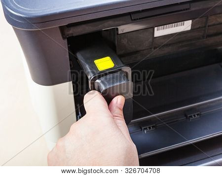 Installing New Toner Cartridge In Laser Multi Function Device On Table In Office