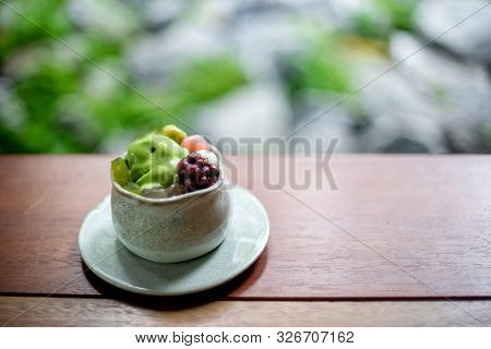 Japan Dessert Food In The Ceramic Cup On Wood Table, With Blur Blackground In Restaurant.