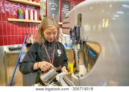 HONG KONG, CHINA - CIRCA JANUARY, 2019: indoor portrait of barista in Pret a Manger. Pret a Manger is an international sandwich shop chain based in the United Kingdom.