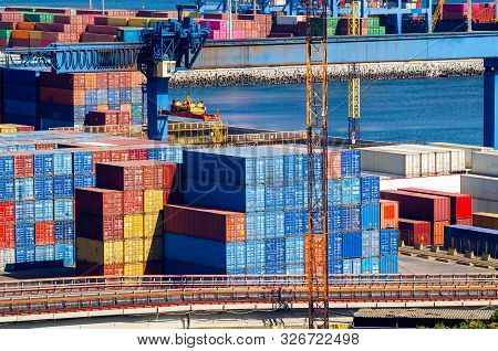 Stacked Cargo Containers In Storage Area Of Freight Sea Port