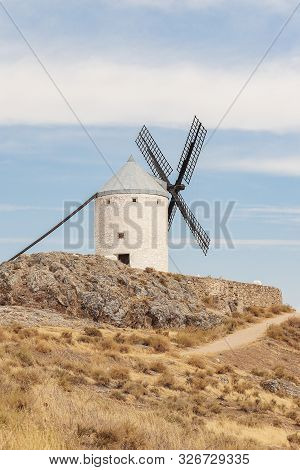 Vertical View Of An Old Windmill On The Calderico Hill Of The Spanish Municipality Of Consuegra On A