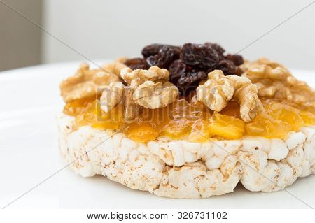 Rice Biscuit With Cream And Sweet Papaya, Nuts And Raisins.