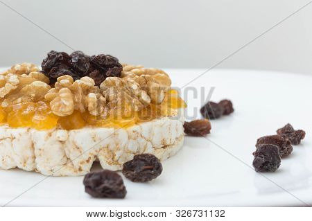 Rice Biscuit With Cream And Sweet Papaya, Nuts And Raisins.