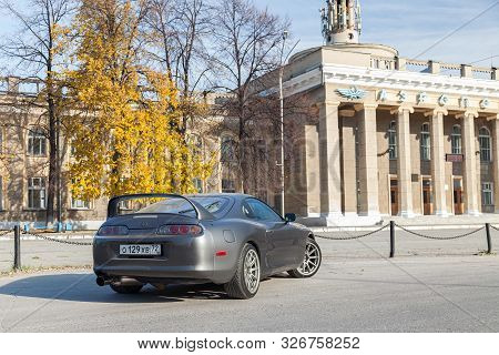 Novosibirsk, Russia - 10.09.2019: A Rare Japanese Sports Car In The Back Of A Gray Toyota Supra Coup