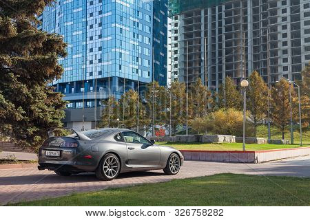 Novosibirsk, Russia - 10.09.2019: A Rare Japanese Sports Car In The Back Of A Toyota Supra Coupe In 