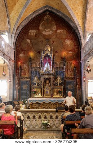 Rocamadour, France - September 3, 2018: The Black Madonna In The Chapel Of Our Lady At  Basilica Of 