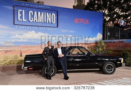 LOS ANGELES - OCT 07:  Aaron Paul and Vince Gilligan arrives to the Netflix premiere of 