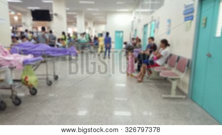 Blurred Background Of Out Patient Department(opd) Of A Hospital With Patients.