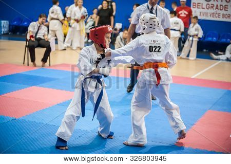 Little Kids And Children In Sport Kimono. Kyokushin Karate Tournament