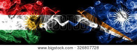 Kurdistan Vs Marshall Islands Smoke Flags Placed Side By Side. Thick Colored Silky Smoke Flags Of Ku