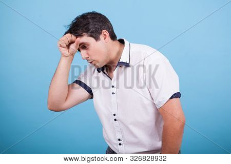 Caucasian Thinking About A Dilema With Hand On His Forehead