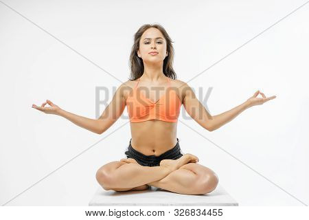 Cute Girl Doing Yoga On White Background Isolated.