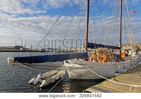 Saint-malo, France, September 30, 2019 : A Schooner In The Harbor Of Saint-malo. The Walled City Had