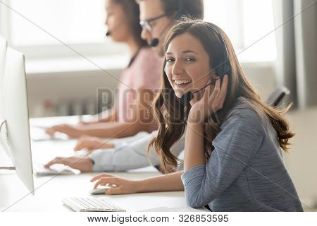 Call Center Employee Female Sitting At Workplace Pose For Camera