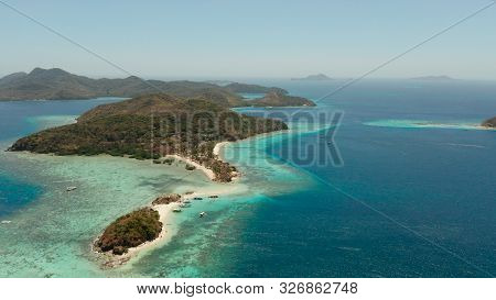 Aerial View Tropical Beach With White Sand And Clear Blue Sea. Tropical Landscape With Islands And B