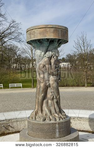 Bad Nauheim, Germany - Mar 30, 2018: Fountain Adam And Eve In Paradise In Bad Nauheim, Germany. Arti